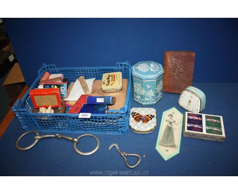A quantity of miscellanea including playing cards, tins, leather bound volume of 'Mill on the Floss' etc