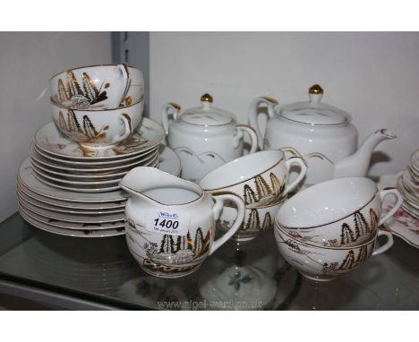 A Japanese lithophane Geisha Teaset of six cups, saucers and tea plates, sucrier and milk jug.