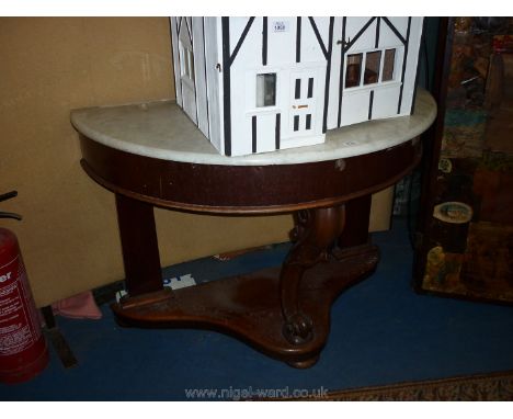 A Victorian Mahogany demi-lune Console Table having platform base and scroll central support and having a grey veined white m