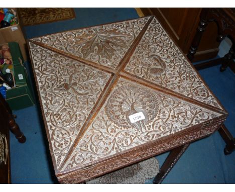 An unusual, profusely carved Mahogany and other woods Envelope Table depicting a Peacock, an Antelope/Ibis, an exotic bird an