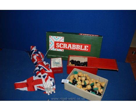 Two carved wooden vintage chess sets with Scrabble game, Union Jack bunting and playing cards.