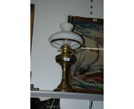 A brass Lamp with glass shade