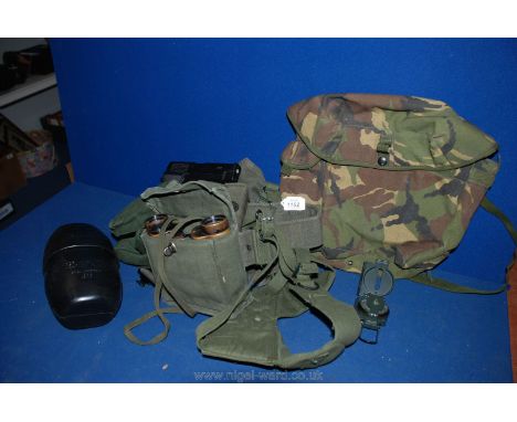 An Army combat belt and camouflage bag. 