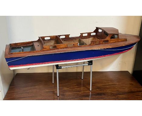 A wooden model boat (90cm x 26cm)