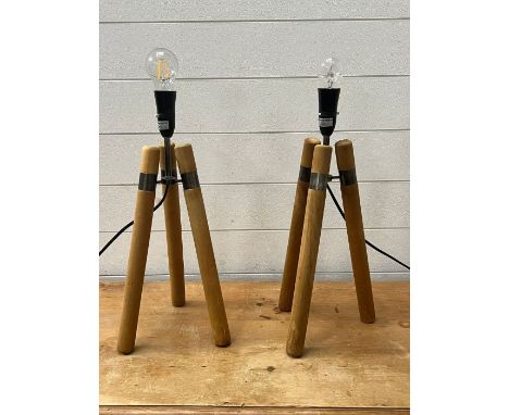 A pair of contemporary tripod lamps 