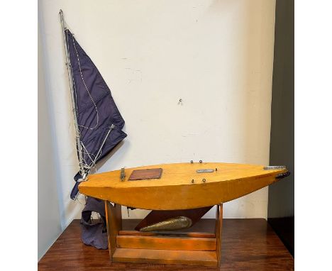 A wooden racing boat model on stand (H115cm W80cm)