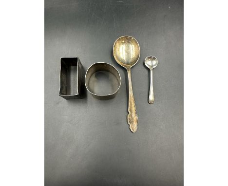 A selection of silver items to include a napkin ring and a spoon (Total weight 72g)