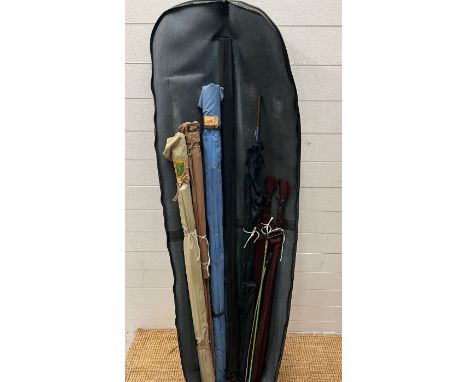 A selection of fishing rods, fishing reels and fishing bag with storage tub and a vintage stool inside 