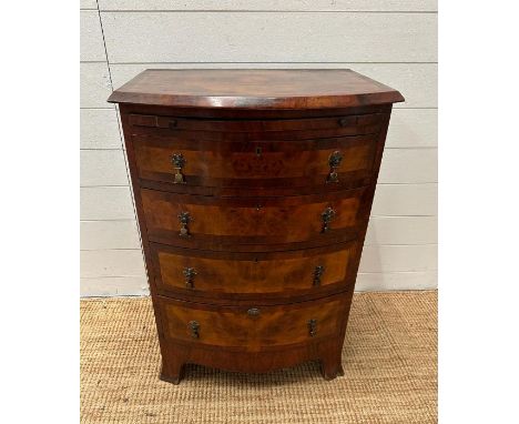 A bow fronted caddy topped chest of four drawers (H 85cm x D 49cm x 61cm)