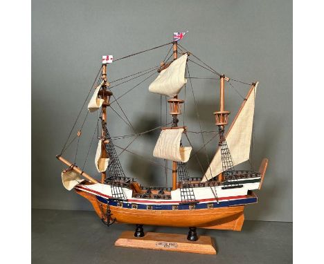 A wooden scale model of The Golden Hind on plinth 