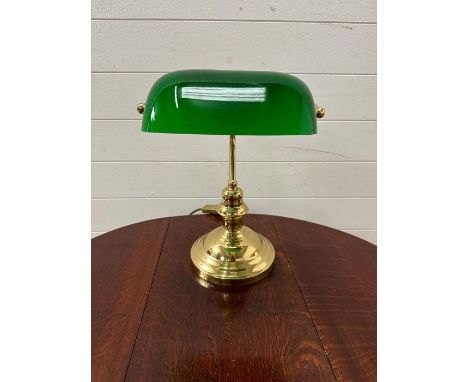 Brass bankers lamp with green glass shade.
