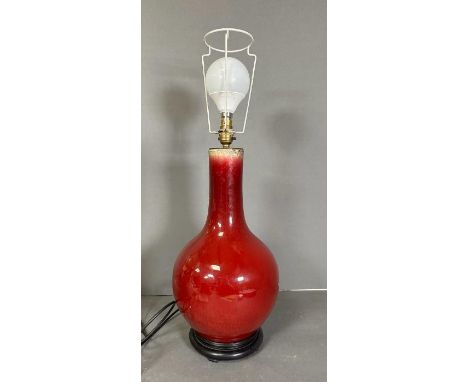 A Chinese Sang De Boeuf Baluster Vase converted to a table lamp. (Height Excluding light fitting 45cm)