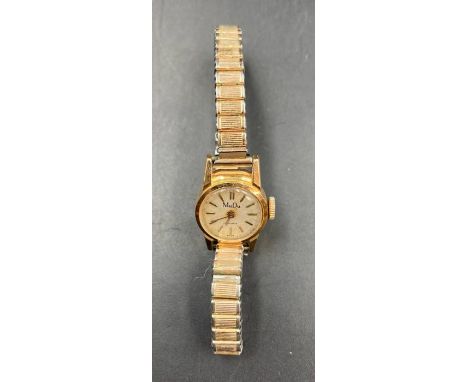 A Mudu ladies vintage wristwatch in 18ct gold with expandable stainless steel band.