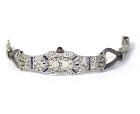 A lady's Art Deco diamond and sapphire cocktail watch, with a ruby set crown, on a fabric strap, case stamped 'platinum', tot
