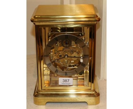 A brass four glass chiming mantel clock, signed Kieninger, with paperwork and box (as new) 