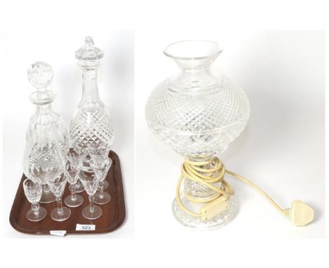 Two Waterford crystal decanters, a set of six liqueur glasses, a brandy bloom and another liqueur glass, together with a cut 