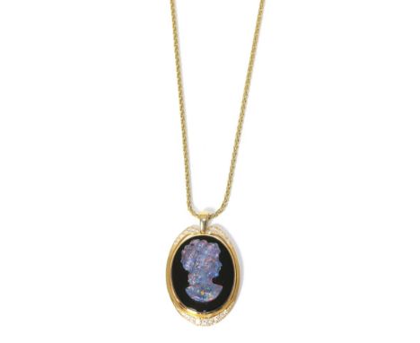 An opal triplet, onyx and diamond cameo pendant, stamped '18CT' on a chain 32.22g gross