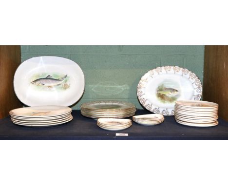 A Wedgwood and Co Ltd set of six fish plates with a platter; a Crown Staffordshire set of six small fish dishes and another t