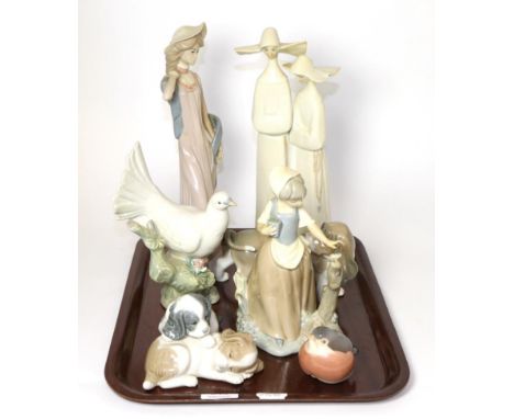 A Royal Copenhagen model of a robin, two Lladro models, two Nao models and two others similar 