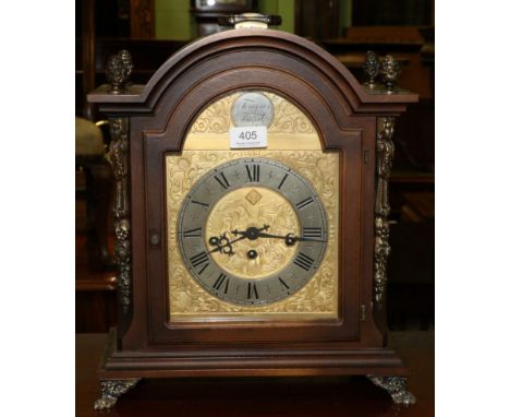 A modern bracket clock with arched dial inscribed Tempus Fugit 