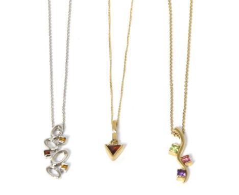 A 9 carat white gold citrine and garnet pendant on chain, pendant measures 2.5cm long, chain length 44cm, a 9 carat gold garn