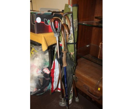 A QUANTITY OF WALKING STICKS, SHOOTING STICK, ETC