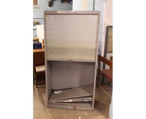 A VINTAGE METAL ROLLER SHUTTER CABINET