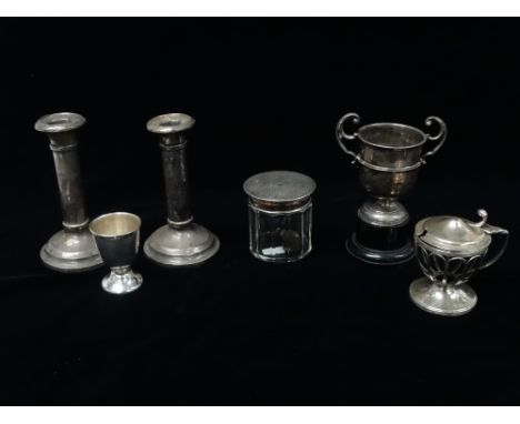 Silver - A pair of filled silver candlesticks, Birmingham 1919, height 13.5cm, together with a circular glass dressing table 