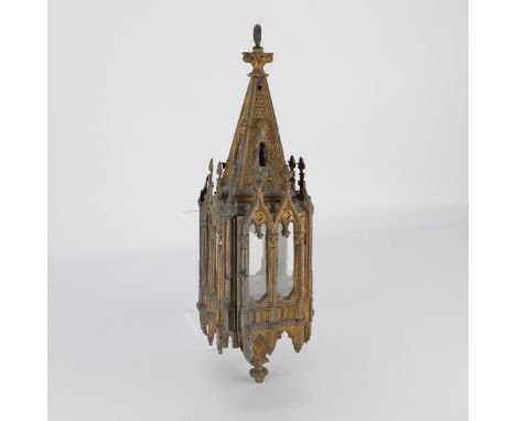 Neogothic hanging brass lantern with paned glass windows. The lantern is in the form of a gothic cathedral with pointed arch 