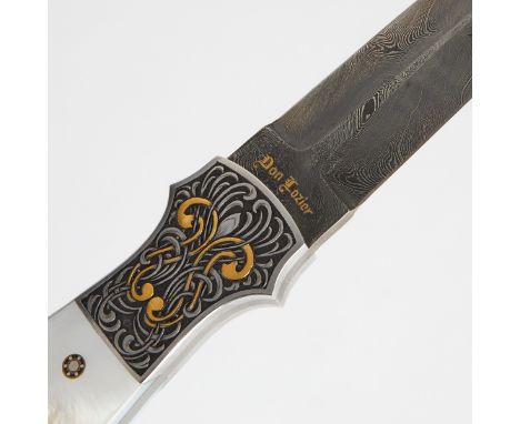 Don Lozier (American, 20th-21st c). One boot knife with a double hollow ground Damascus steel blade; marked along the ricasso