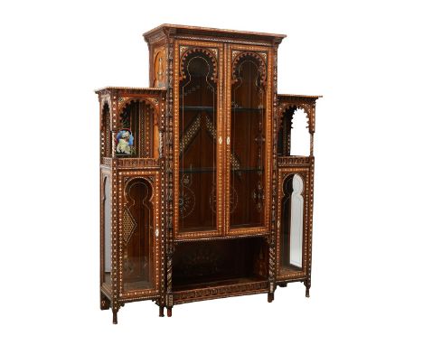 Large Syrian curio cabinet. Inlaid throughout with geometric designs of shell and mother of pearl. With four glass doors; the