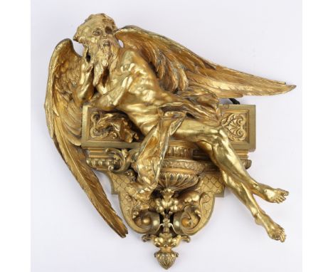 Victorian Neoclassical gilt bronze wall hanging depicting a winged and bearded angel lounging on a shelf. Cast with meticulou