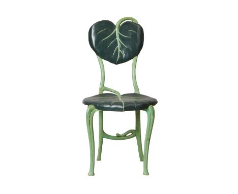 Wooden chair carved and hand painted to resemble two leaves connected with curving vines.Provenance: From the Estate of Horst