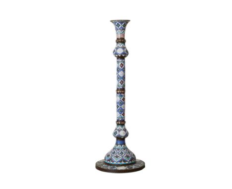 Large Middle Eastern enameled metal candlestick. With alternating cartouches featuring an Arabic inscription and floral motif