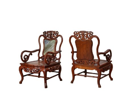 Pair of Chinese Anglo Export carved wood armchairs with scrolling arms and legs and a grape motif. Each with a marble panel i