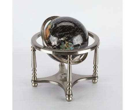 Blue lapis globe inlaid with semi-precious stone. Housed within a silver colored metal frame on four legs with a compass set 