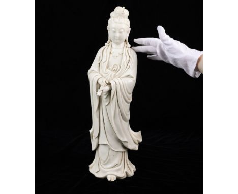 Chinese blanc de Chine porcelain Guanyin with lovely flowing robes. With exquisite details to the figure's face, hands, and c