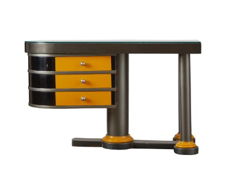 Machine age post modern design desk, likely Italian. This asymmetrical desk rests on three legs. With three drawers and a cur