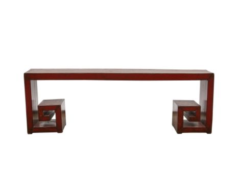 Low Chinese wooden bench or console table, of a red hardwood with scroll feet.Provenance: From the Estate of Horst Rechelbach