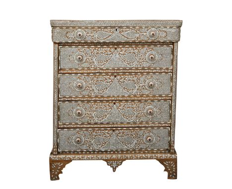 Syrian mother of pearl inlaid wooden chest of drawers. With five drawers. The wood is profusely decorated throughout with mot