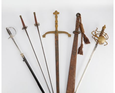 Group of six 19th to 20th c. European swords including:One large 20th c. Toledo made single edged sword with an etched ricass