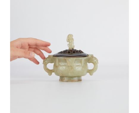 A finely carved double handled Chinese jade censer with a carved wood lid mounted with a pale celadon jade monkey carving..Pr