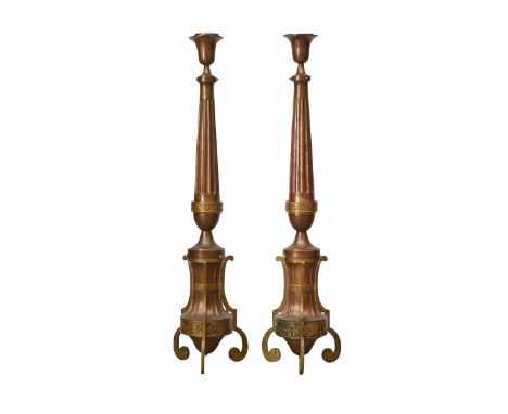 Pair of copper lamp stands, possibly Italian. With scrolling feet, vasiform bodies, and tapering fluting stems that are surmo