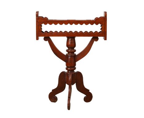 19th century Spanish wooden candle stand for an altar. The rectangular stand with scalloped trim rests on three thin scrollin