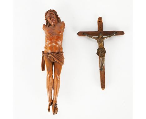 Group of two boxwood or camphor wood crucifixes. One lacking the cross and arms of the crucified Christ. One crucifix with a 