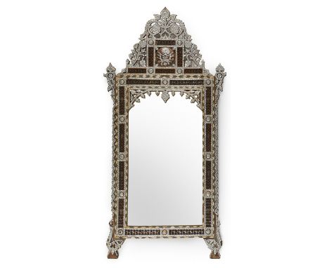 Large Syrian mother of pearl inlaid wooden mirror. The intricately carved wood is inlaid with geometric and floral designs in