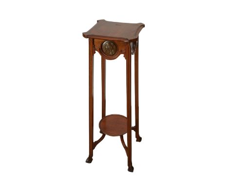 Art Nouveau two tier pedestal stand or sellette side table featuring inset bronze bosses depicting profiles of women in low r