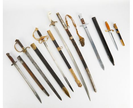 Group of six military swords and knives including:One Soviet naval officer's dirk, 1957, serial # 65160, with Ricasso marking