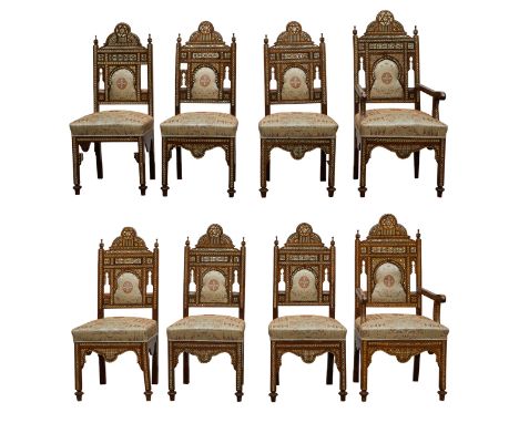 Set of Syrian mother of pearl inlaid wooden chairs including two armchairs and six side chairs. The intricately carved wood i