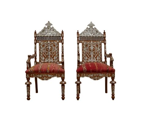 Pair of Syrian mother of pearl inlaid wooden armchairs. Richly decorated with floral motifs in mother of pearl utilizing the 